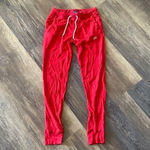 Red Nike joggers - small